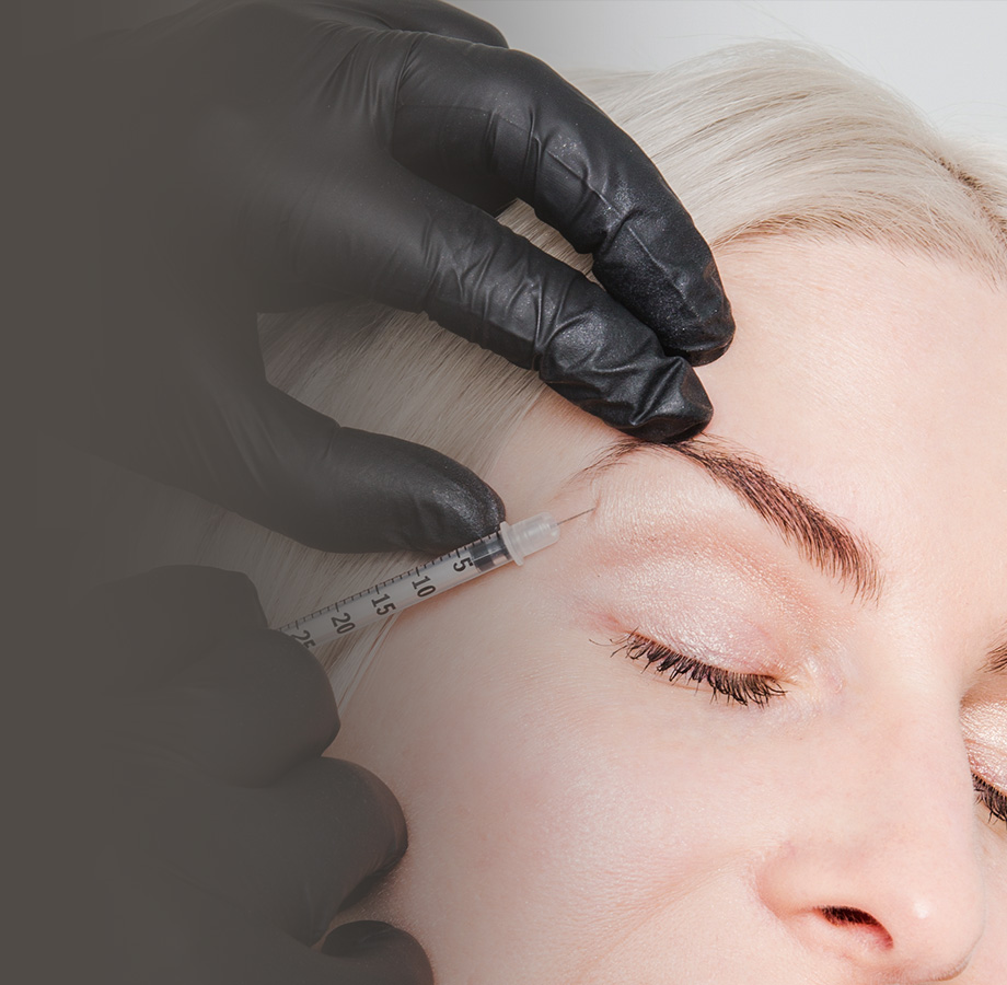 Patient receiving an injection above the eye